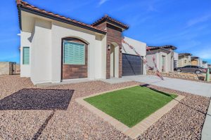 A brand new luxury Santana home is displayed from the front-left corner in El Paso